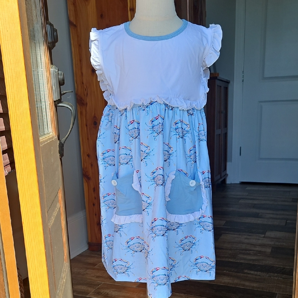 Blue and White Sleeveless Dress with Ruffle Details And Pockets